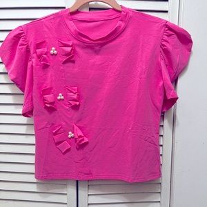 Pink crop top new with out tag. 18 inches wide and 18 inches long